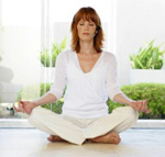 A woman practicing awareness through meditation.